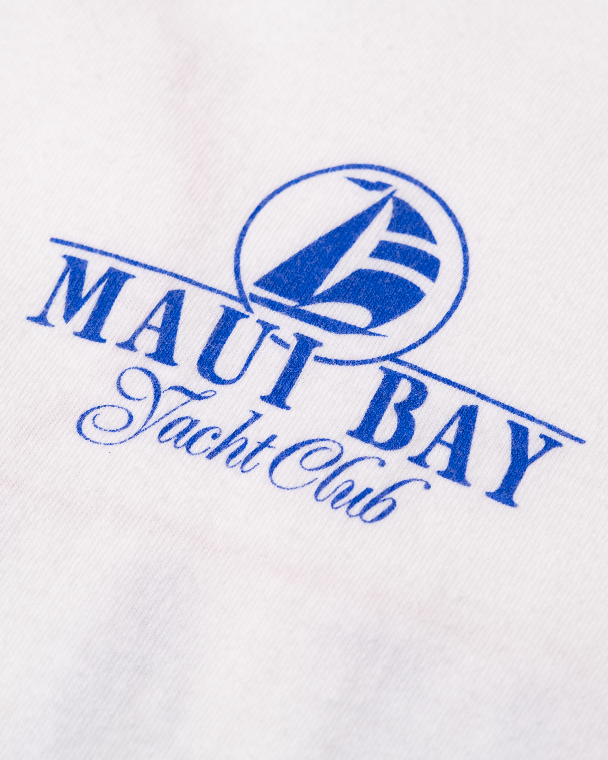 Close-up of small blue Maui Bay Yacht Club chest logo on 1987 vintage T-shirt.