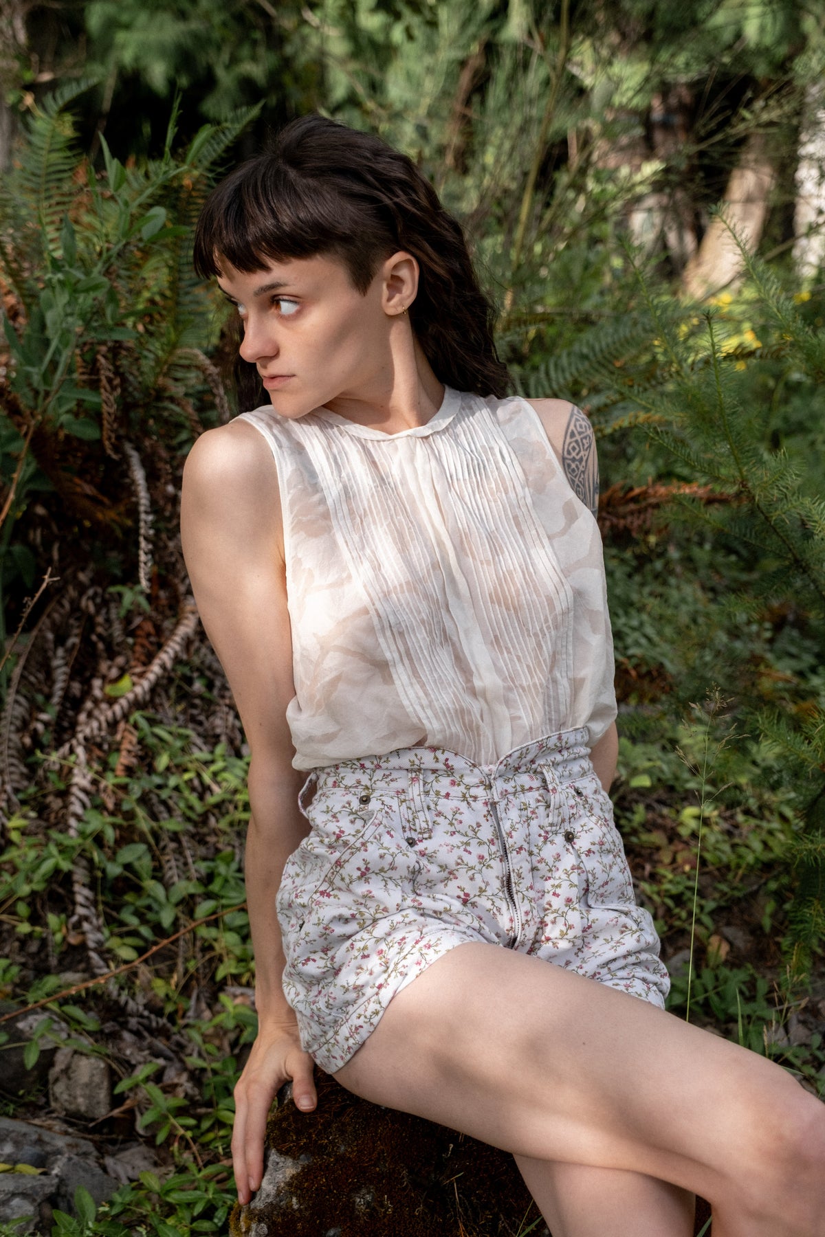 Model wearing early-2000s Armani Collezioni ivory pintuck sleeveless blouse.
