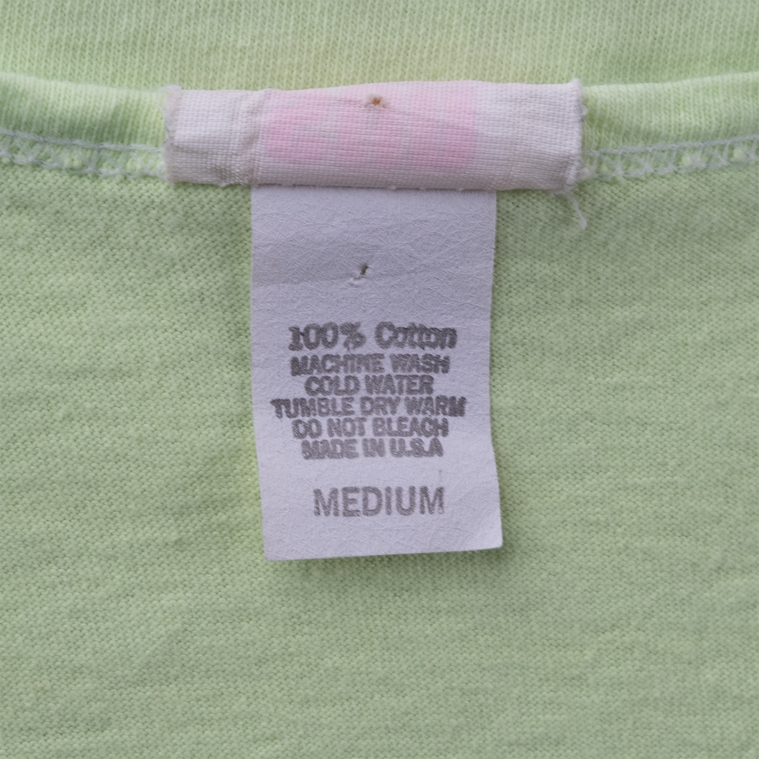 Sun Lover care label showing 100% cotton, Made in USA, and Medium sizing.