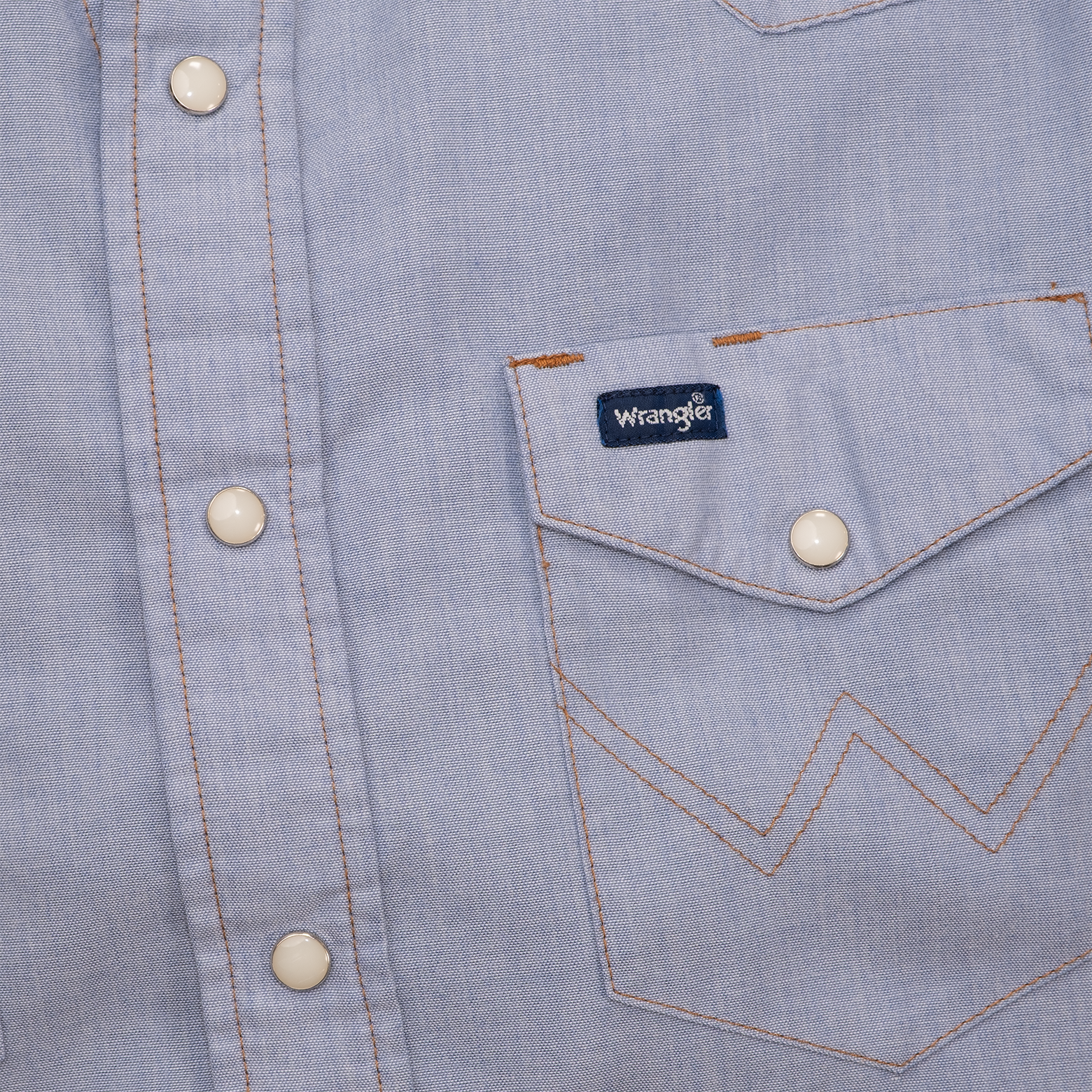 Wrangler label and W-stitched chest pocket on vintage western shirt