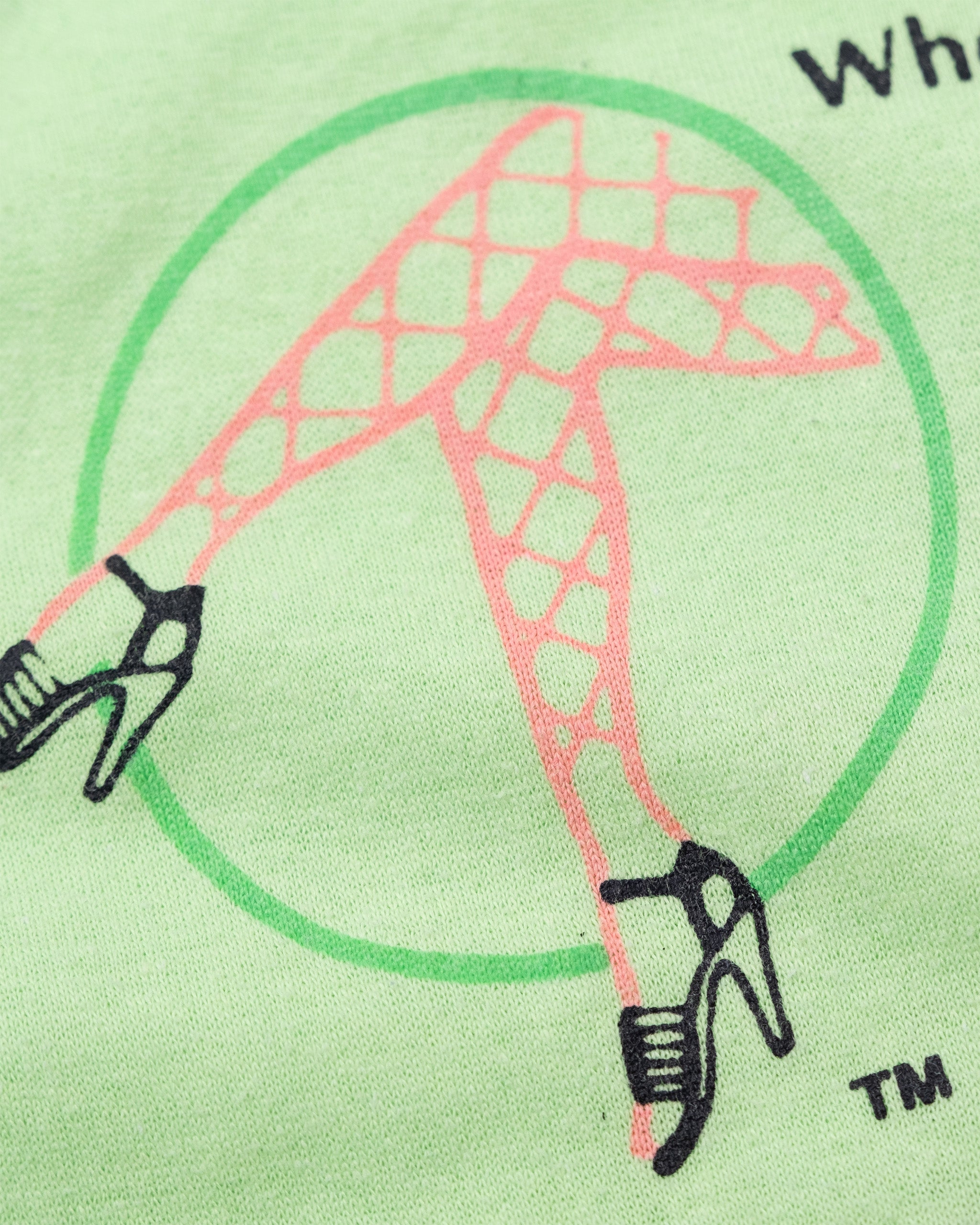 Close-up of Deja Vu showgirl legs and high-heel graphic in coral, green, and black.