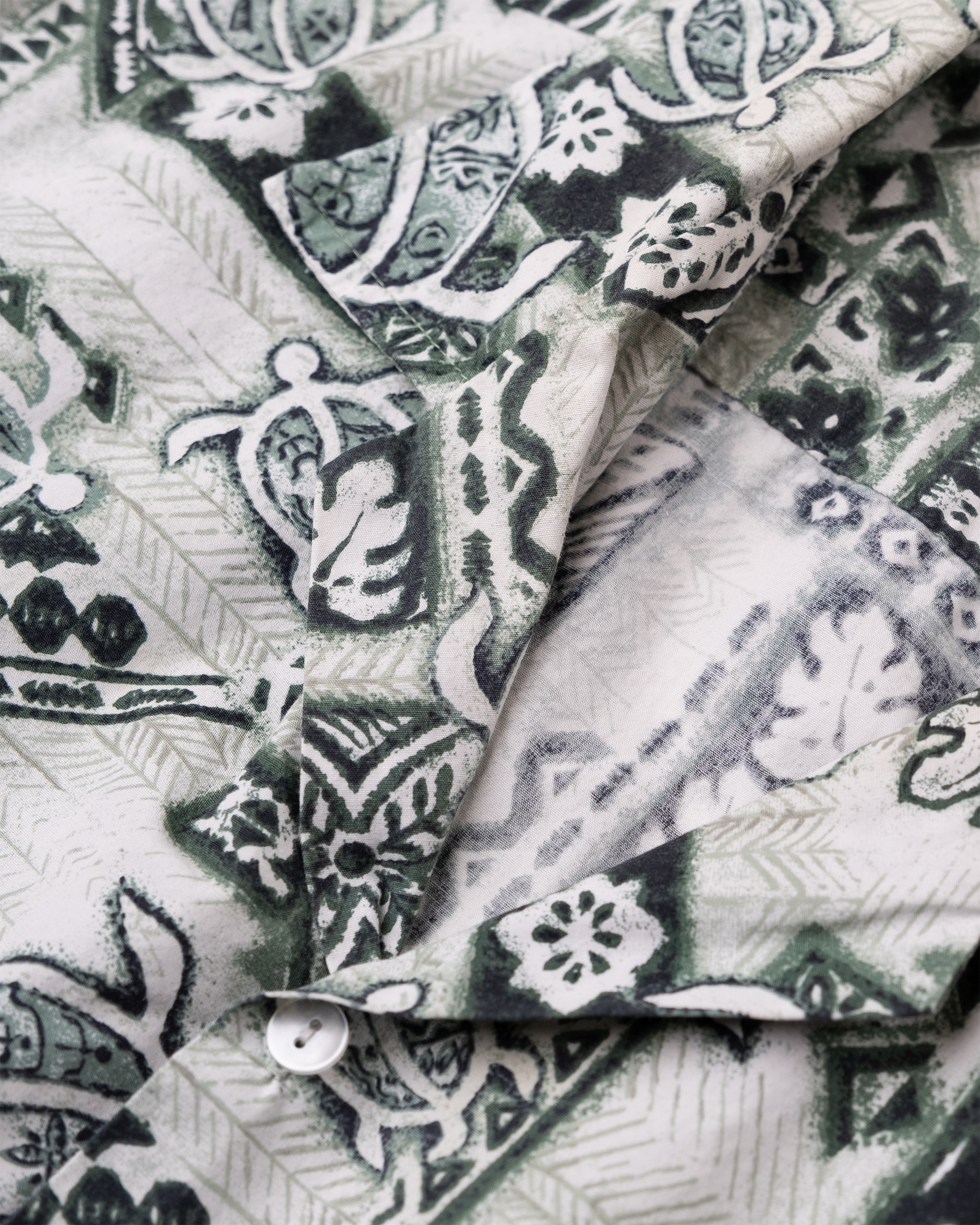 Collar and lapel detail of vintage Made in Hawaii sea turtle aloha shirt.