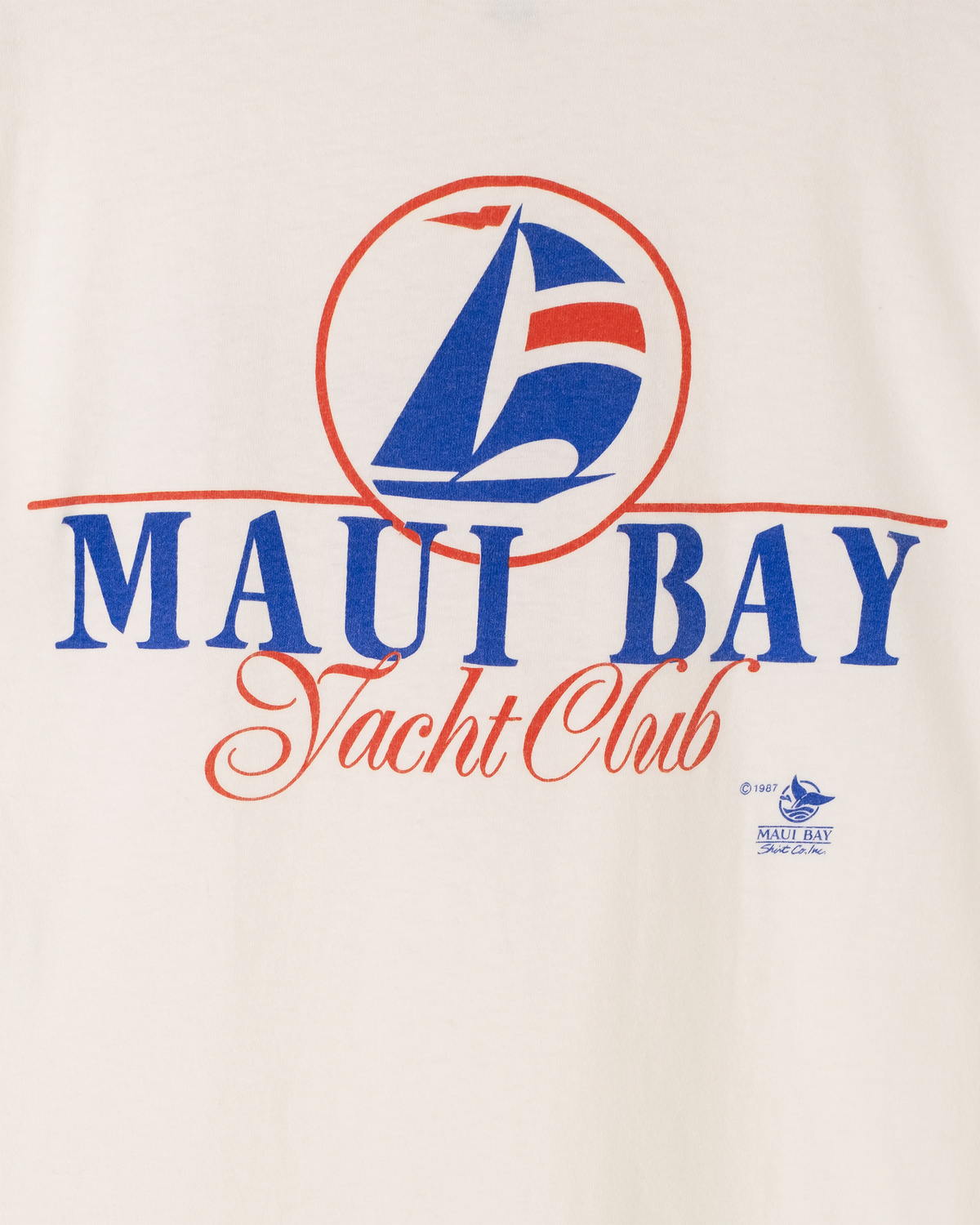 Detailed view of red and blue Maui Bay Yacht Club lettering and sailboat graphic.